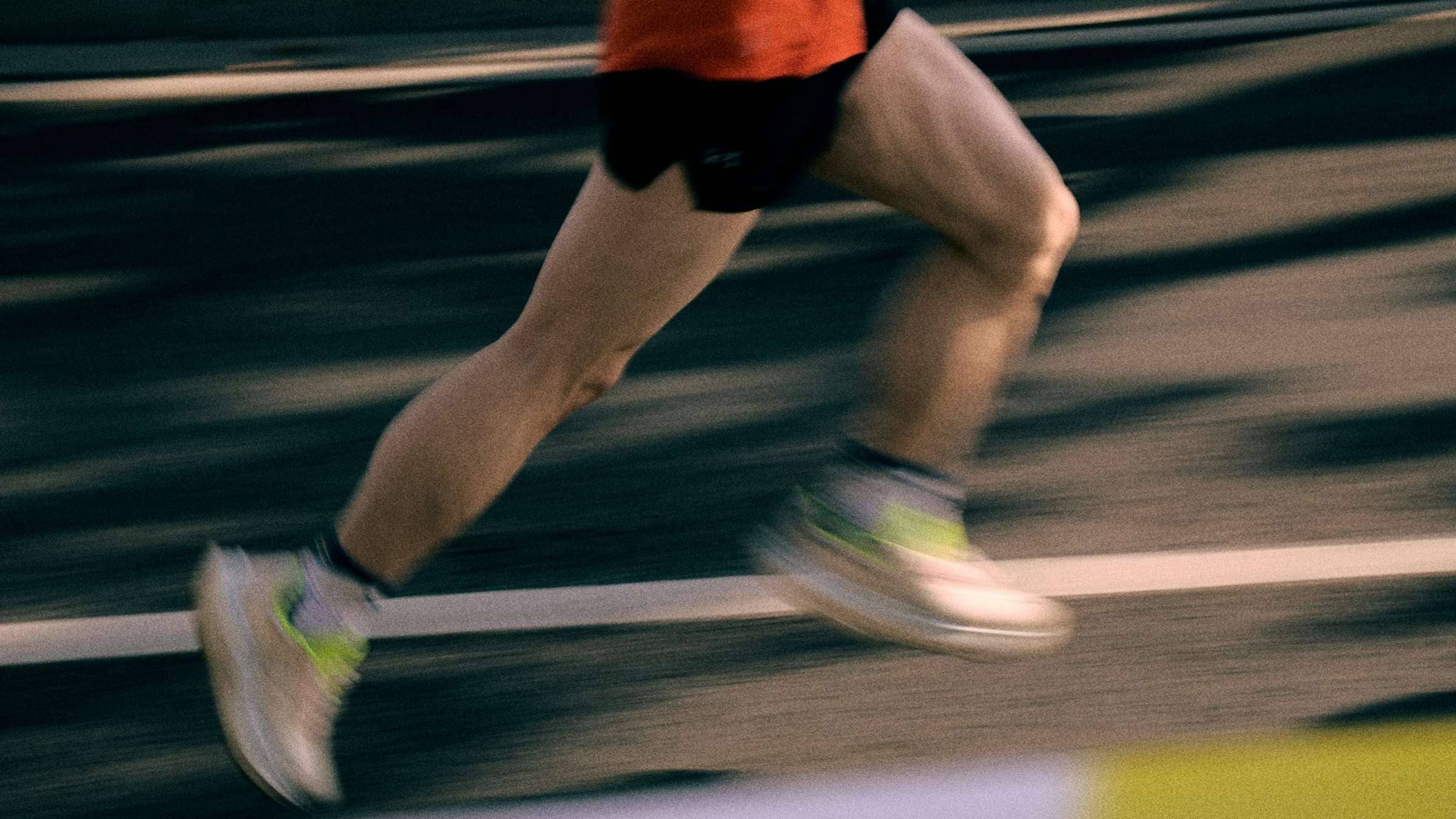 An athlete training with a coach in the gym
